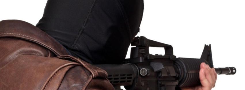 balaclava wearing Terrorist with armalite rifle